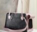 black and pink leather handbag